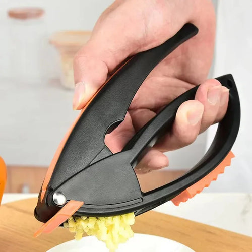 4-in-1 Stainless Steel Garlic Press and Grinder, Manual Plastic Fruit and Vegetable Tool for Mincing Garlic and More - product view 1